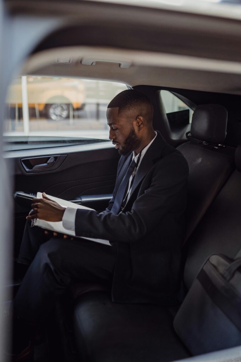 Chauffeur Client Conducting Business in the Car